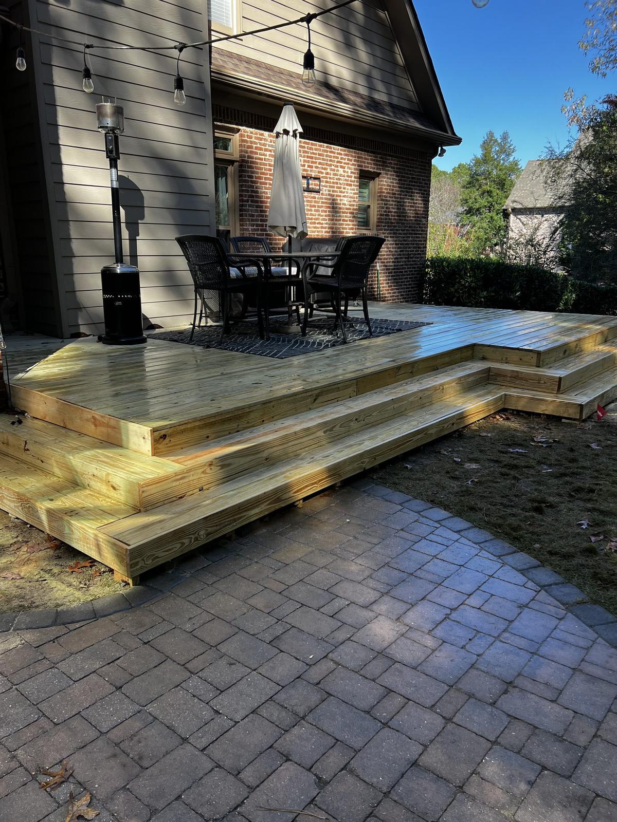 Close-up of a perfectly stained and restored wooden deck, showcasing Alabama Deck Restoration expertise in rejuvenation