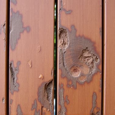 damaged wood fibers from high pressure washing a deck