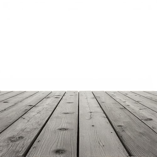 Before deck stain application showing faded wood in Birmingham. A close-up of a pressure-treated deck with faded wood, ready for professional staining and restoration.