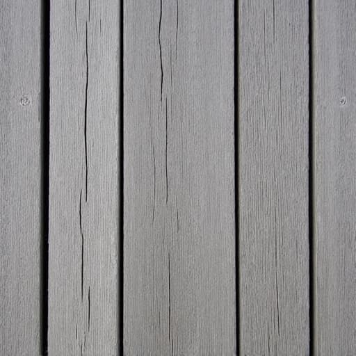 A close-up view of an aged and weathered wooden deck, showing greyed fibers and small cracks, yet still sturdy, awaiting a new protective stain in Birmingham, Alabama.
