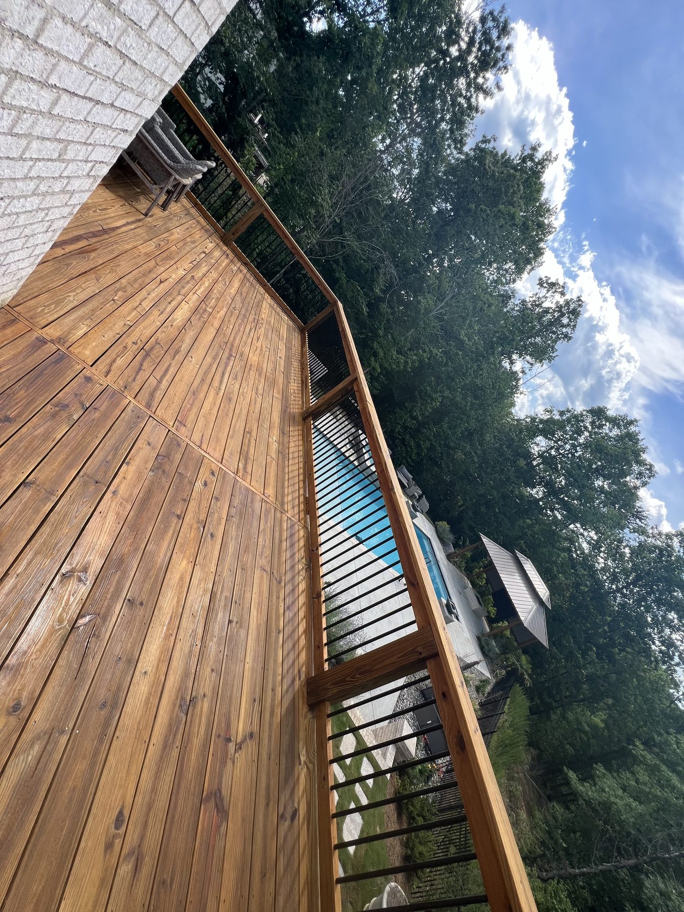 Alabama Deck Restoration logo featuring a house, a paintbrush, and the slogan Love Your Deck Again.