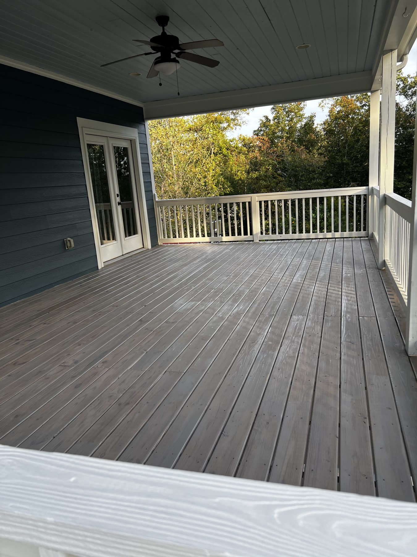 Alabama Deck Restoration logo featuring a house, a paintbrush, and the slogan Love Your Deck Again.